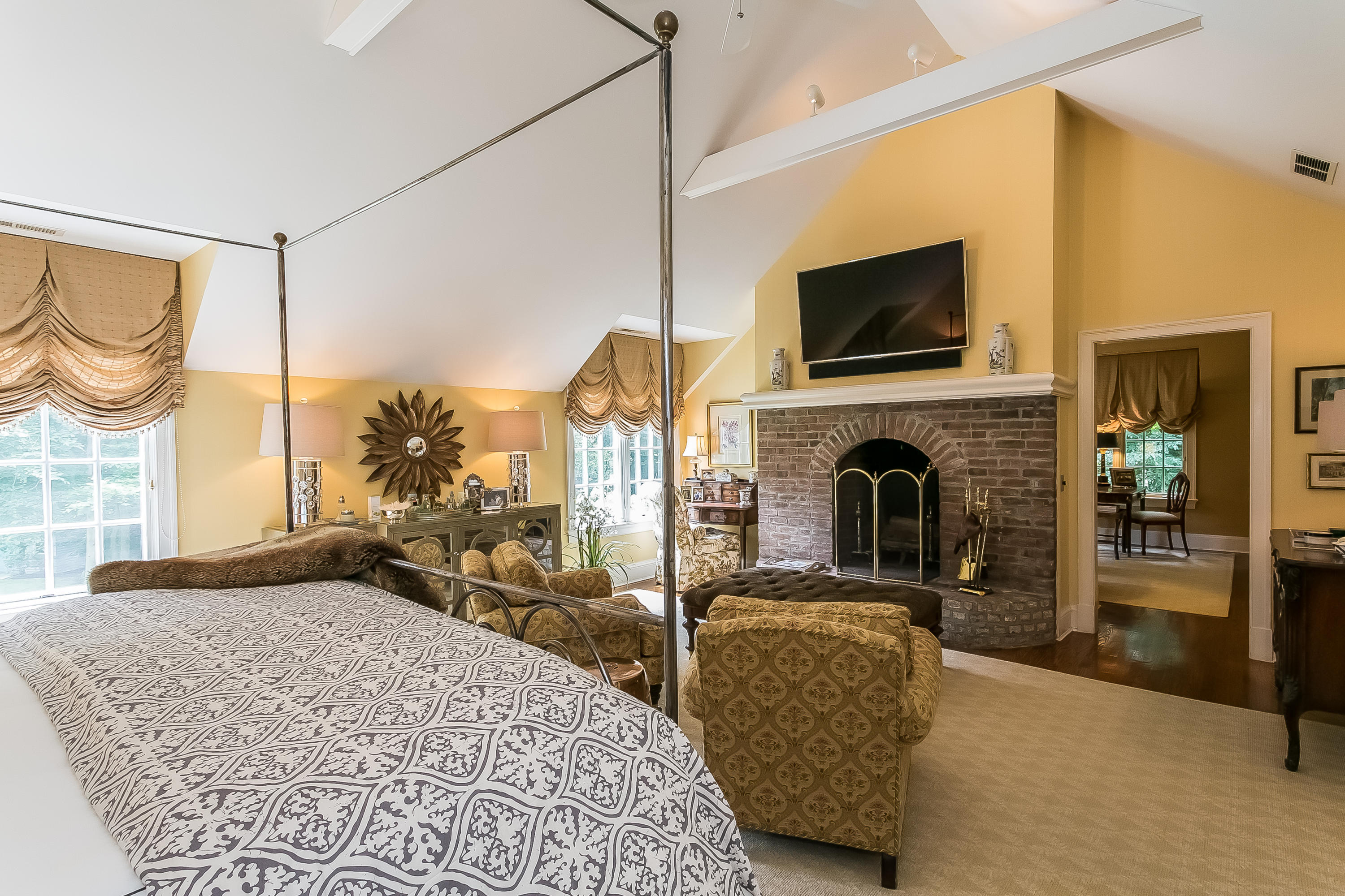 50 Deepwood Road Darien, CT 06820 - Photo 33 of 54 a living room with furniture a flat screen tv and a fireplace