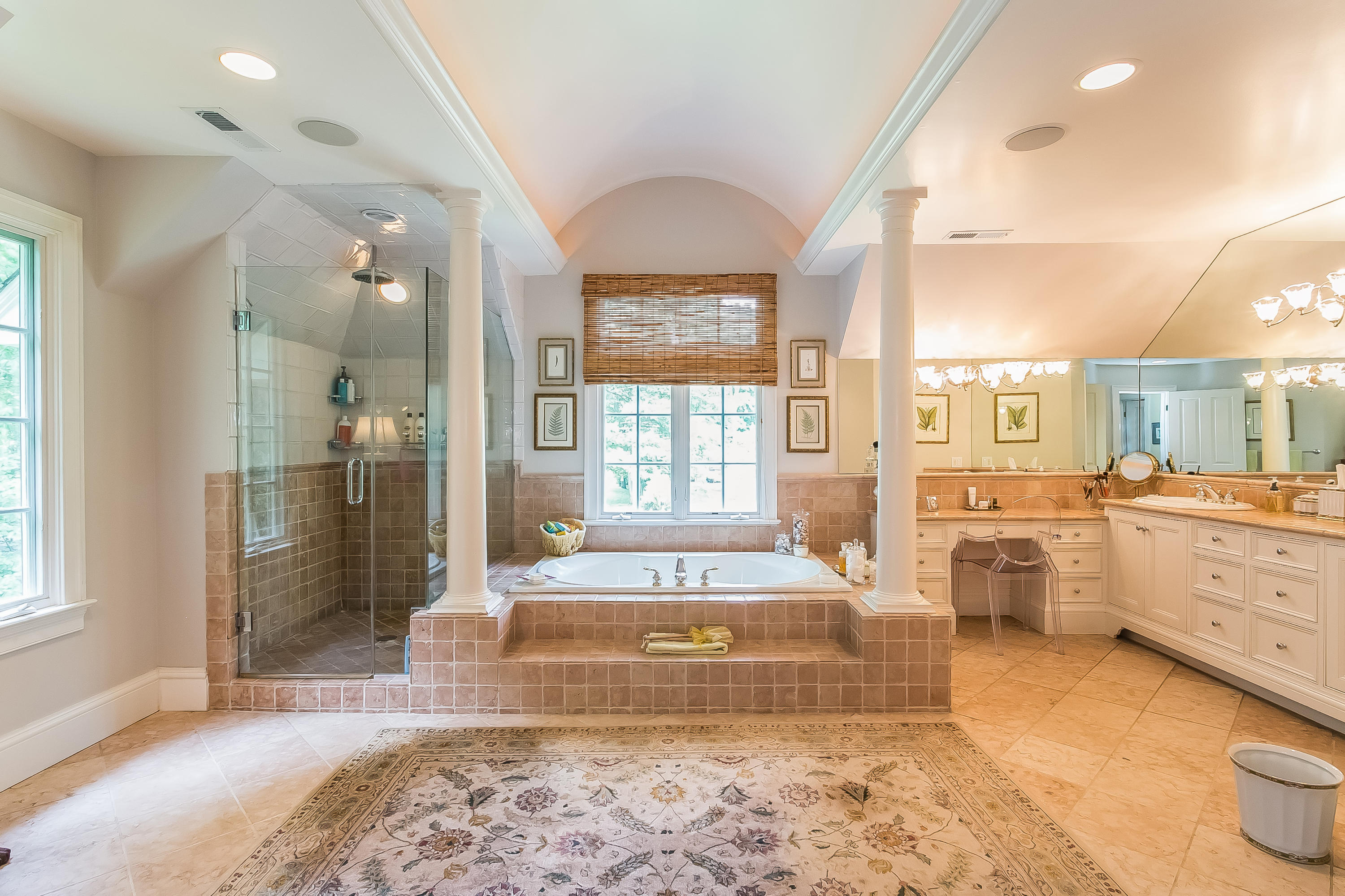 50 Deepwood Road Darien, CT 06820 - Photo 34 of 54 a spacious bathroom with a tub sink and mirror