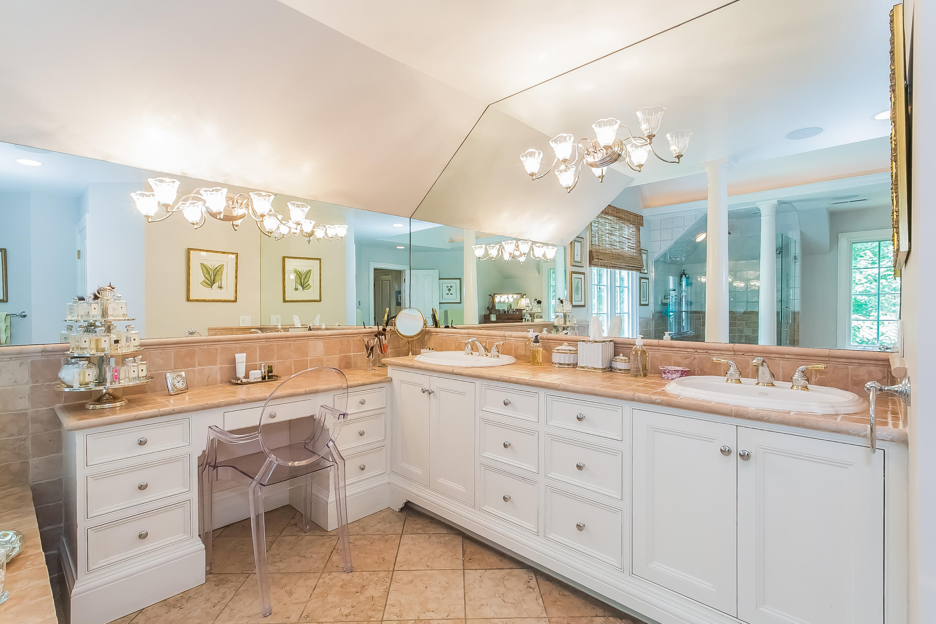 50 Deepwood Road Darien, CT 06820 - Photo 35 of 54 a bathroom with a double vanity sink and a mirror