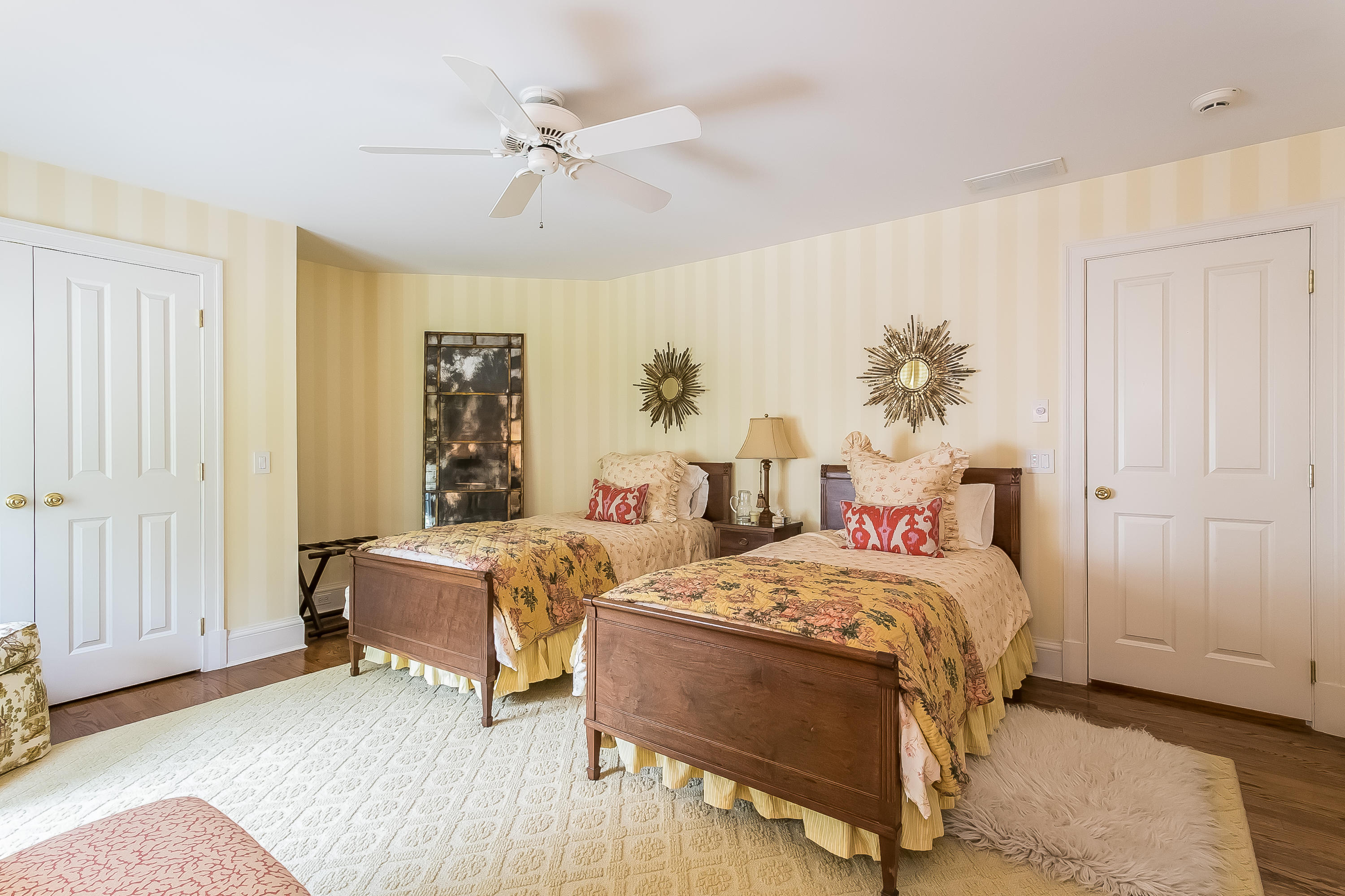 50 Deepwood Road Darien, CT 06820 - Photo 37 of 54 a bedroom with a bed and a chandelier