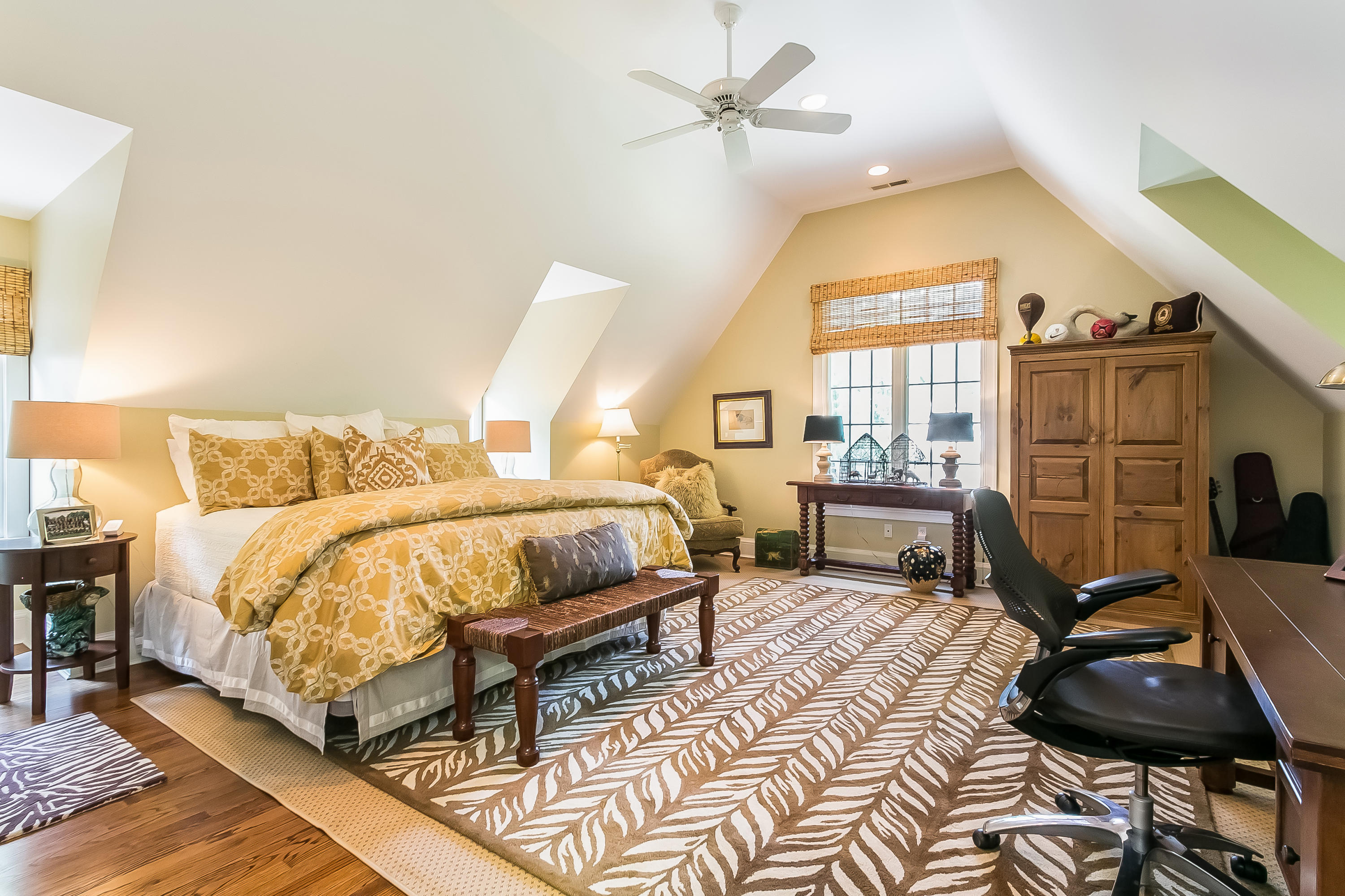 50 Deepwood Road Darien, CT 06820 - Photo 38 of 54 a bedroom with a bed a couch and dresser