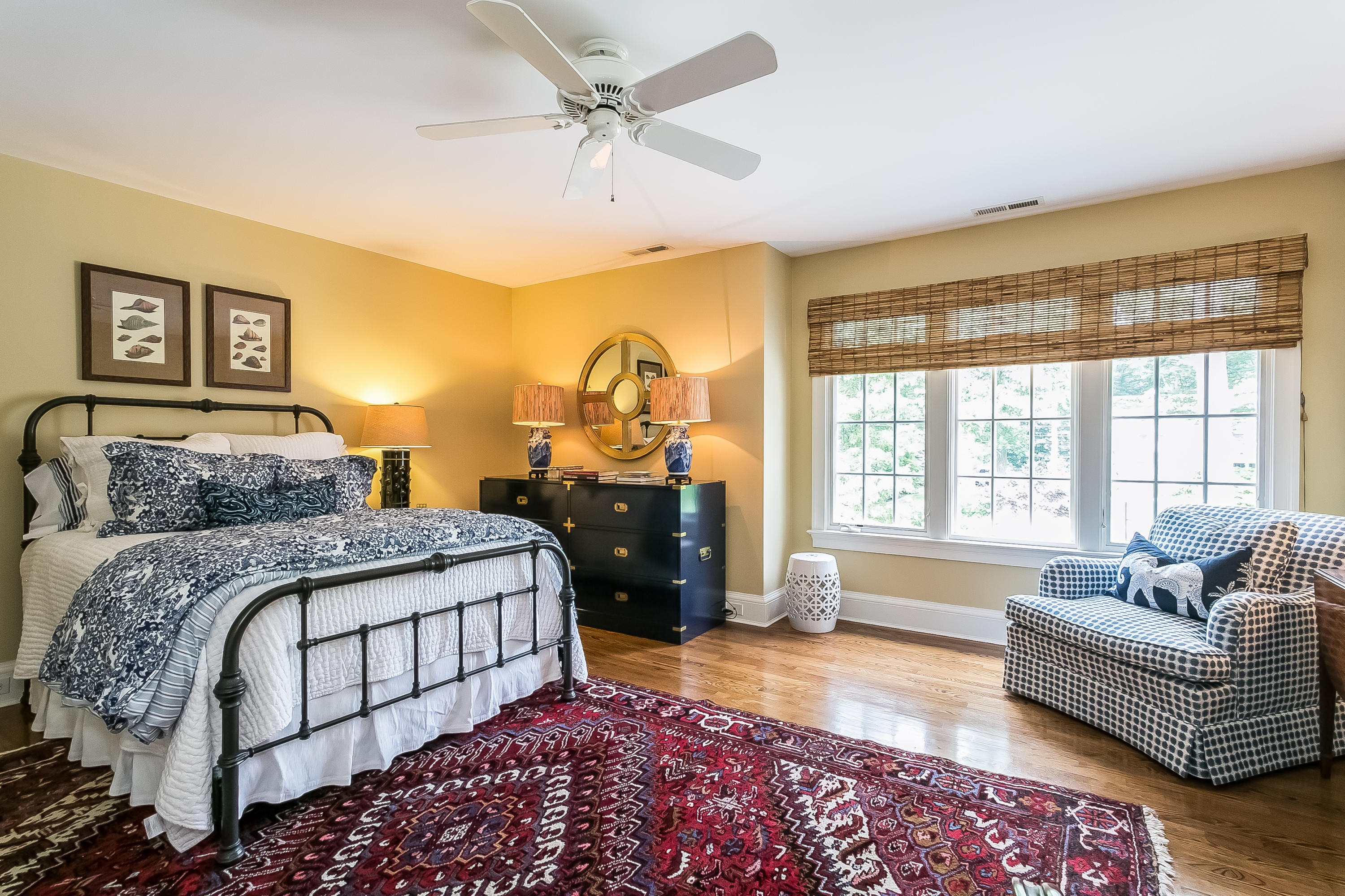 50 Deepwood Road Darien, CT 06820 - Photo 39 of 54 a spacious bedroom with a bed a couch and a window