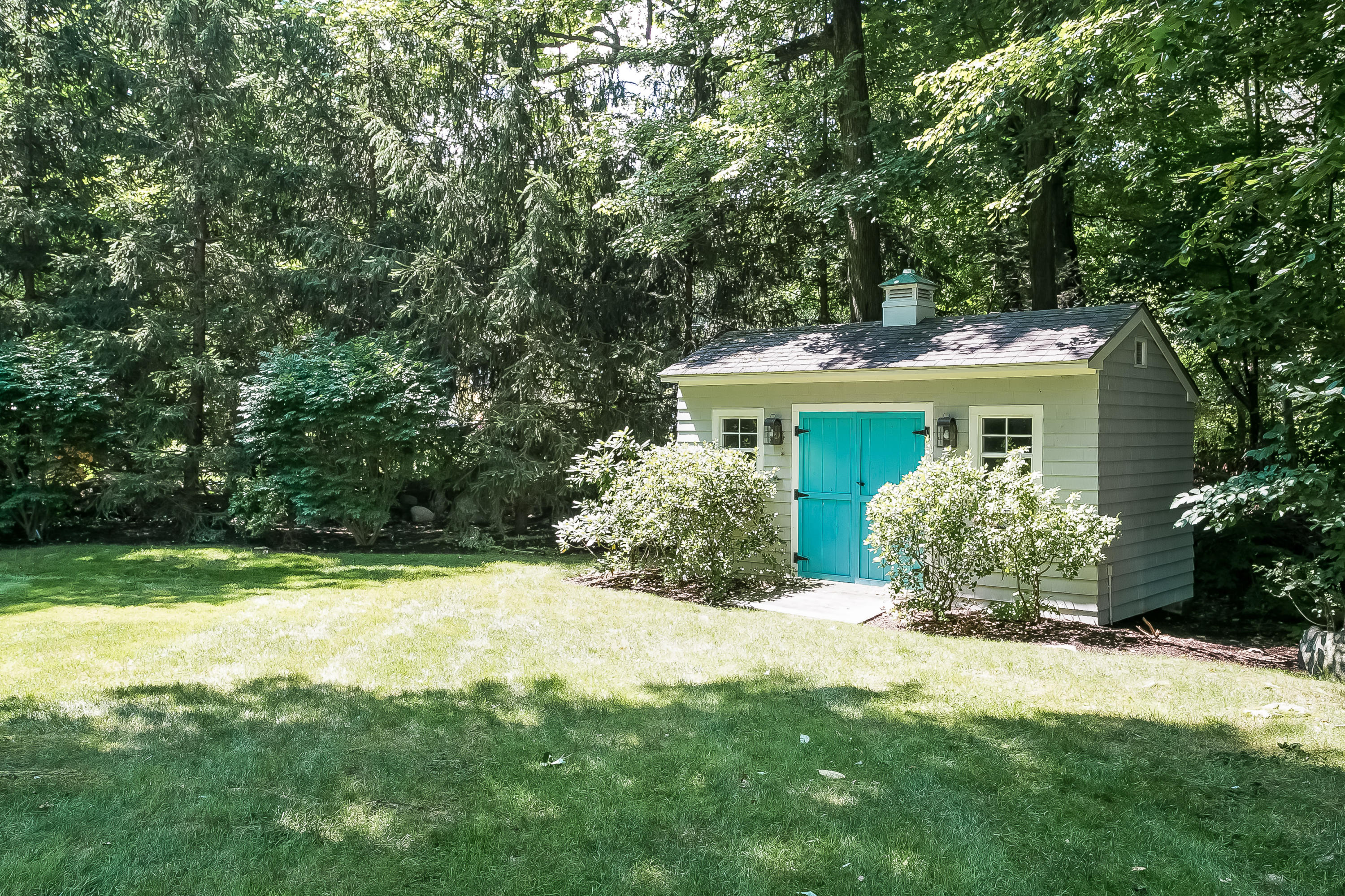50 Deepwood Road Darien, CT 06820 - Photo 49 of 54 a view of a house with a yard and potted plants