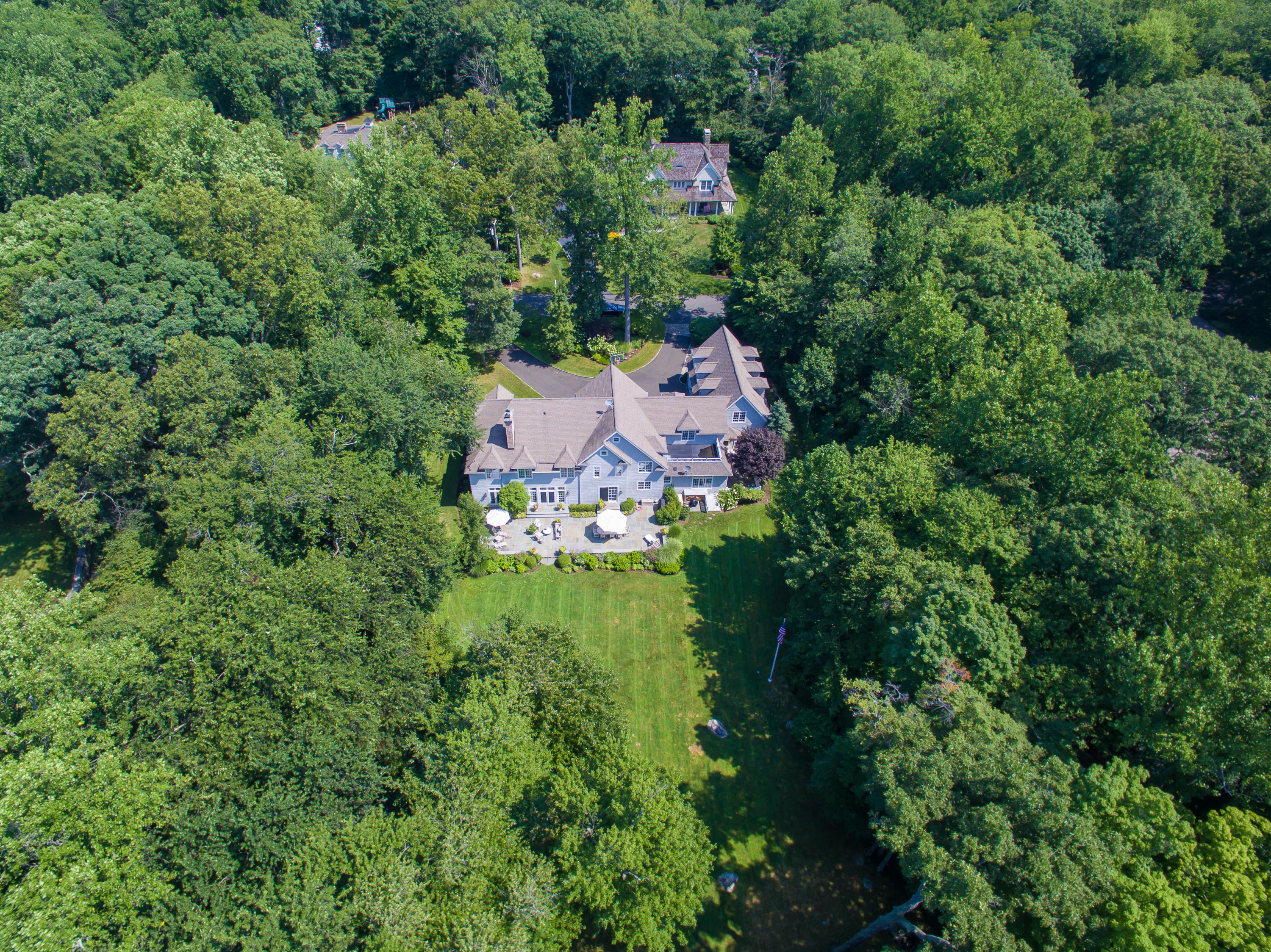 50 Deepwood Road Darien, CT 06820 - Photo 51 of 54 an aerial view of a house with a yard