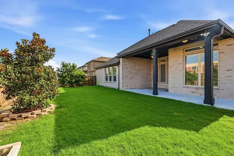 a backyard of a house with lots of green space