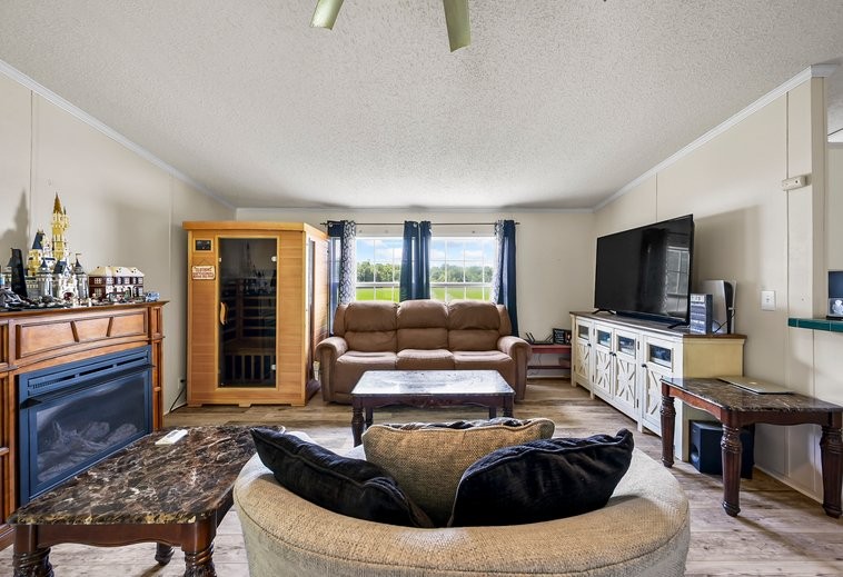 6439 Cedar Grove Road Big Sandy, TN 38221 - Photo 6 of 38 a living room with furniture and a flat screen tv