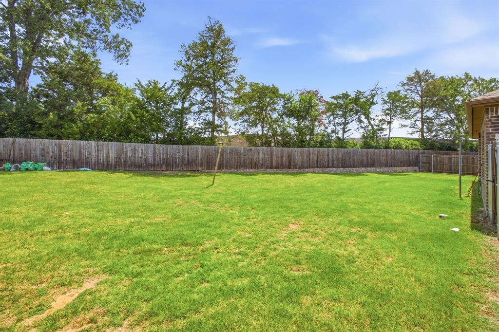 1328 Broaddus Road Forney, TX 75126 - Photo 29 of 31 Expansive grassy backyard featuring a full privacy fence
