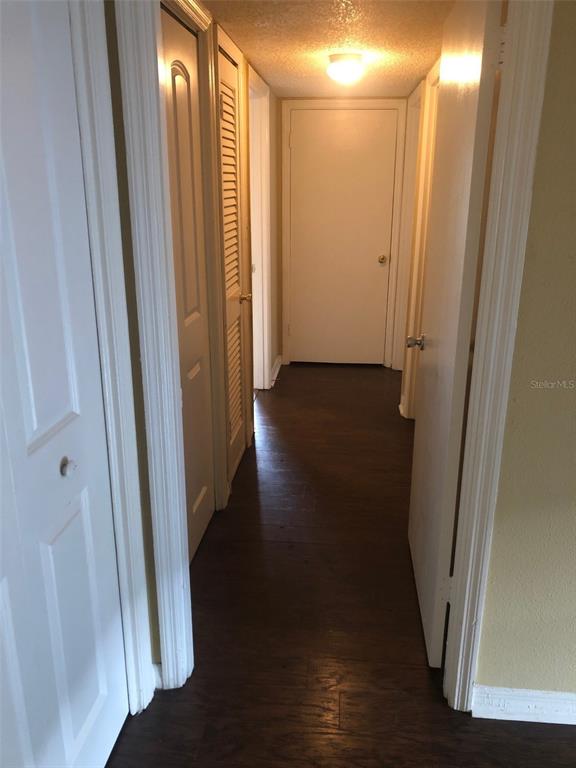 315 Wymore Road, Unit 207 Altamonte Springs, FL 32714 - Photo 11 of 21 a view of a hallway with wooden floor