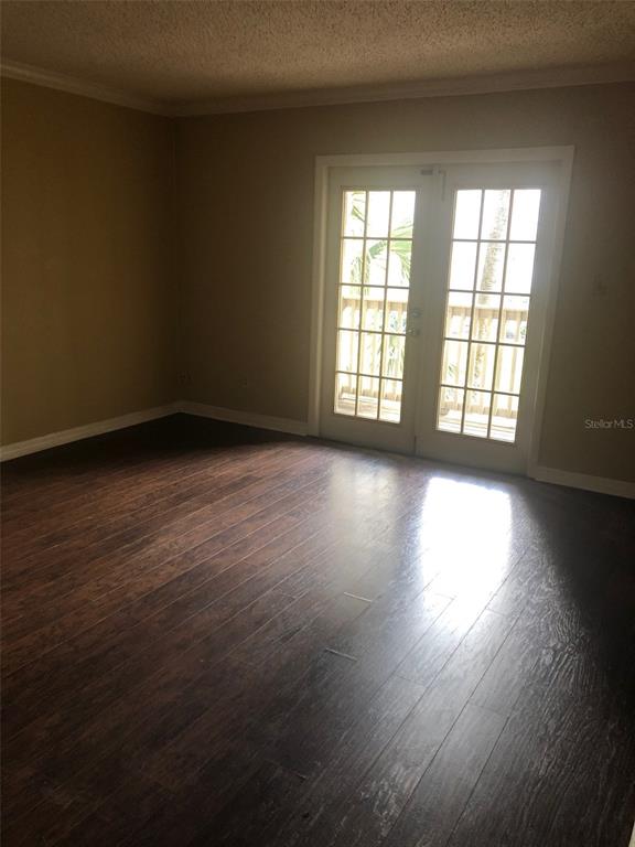 315 Wymore Road, Unit 207 Altamonte Springs, FL 32714 - Photo 17 of 21 an empty room with wooden floor and windows