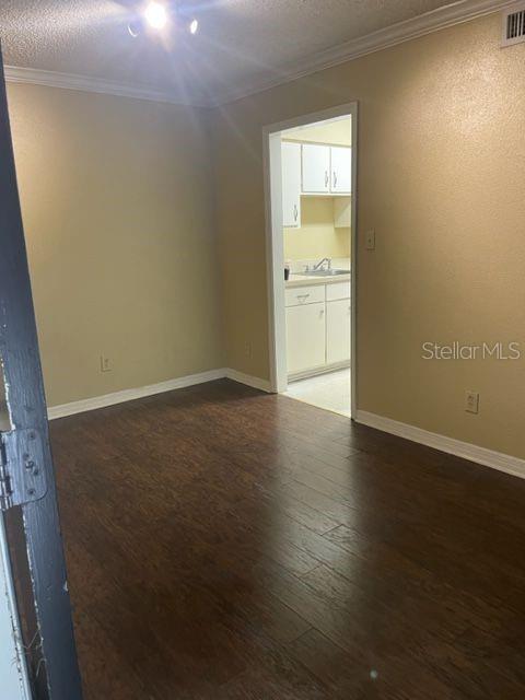 315 Wymore Road, Unit 207 Altamonte Springs, FL 32714 - Photo 19 of 21 an empty room with wooden floor and windows