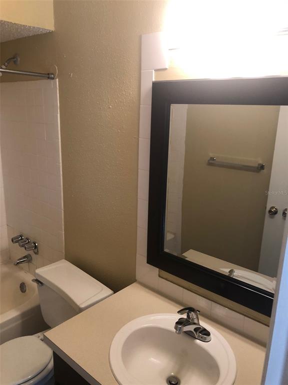 315 Wymore Road, Unit 207 Altamonte Springs, FL 32714 - Photo 20 of 21 a bathroom with a sink and a mirror