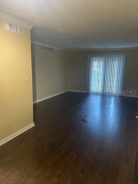 315 Wymore Road, Unit 207 Altamonte Springs, FL 32714 - Photo 2 of 21 an empty room with wooden floor and windows
