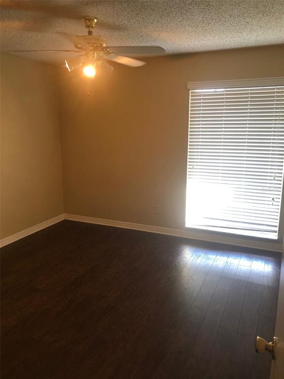 315 Wymore Road, Unit 207 Altamonte Springs, FL 32714 - Photo 4 of 21 a view of empty room with wooden floor and fan