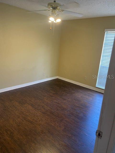 315 Wymore Road, Unit 207 Altamonte Springs, FL 32714 - Photo 5 of 21 a view of an empty room with wooden floor and a window