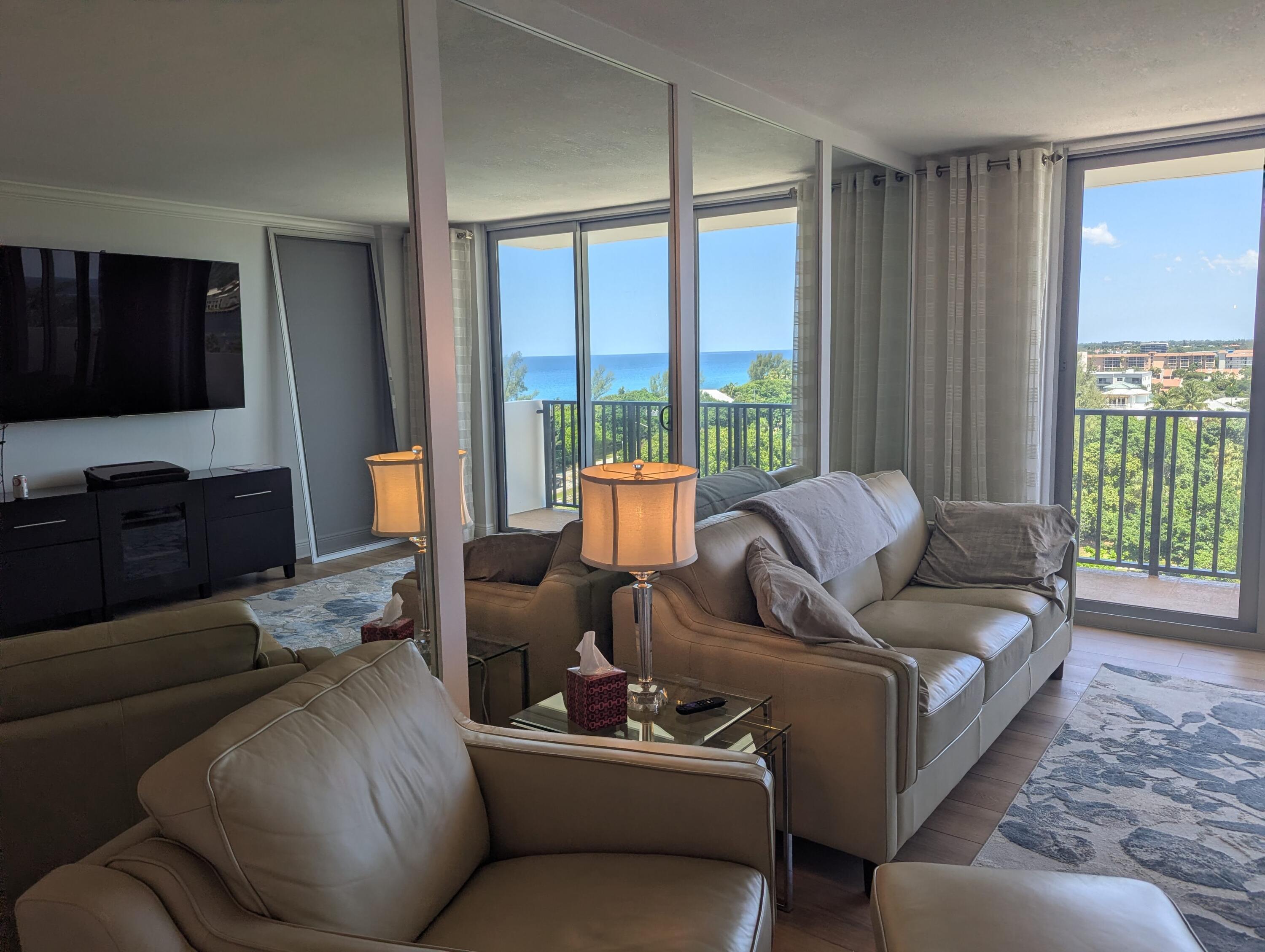 2121 North Ocean Boulevard, Unit 1006E Boca Raton, FL 33431 - Photo 32 of 64 a living room with furniture and a flat screen tv