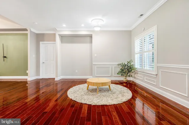 a living room with fireplace furniture and a flat screen tv