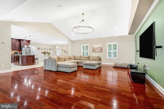 a kitchen with stainless steel appliances a refrigerator and a stove top oven