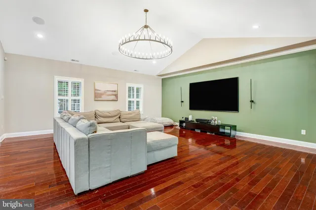 a kitchen with stainless steel appliances granite countertop a kitchen island a stove and a sink