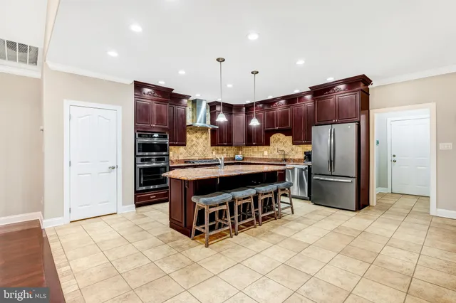 a view of a dining room with furniture windows and wooden floor