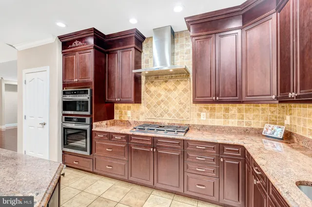 a view of a kitchen with a sink and cabinets