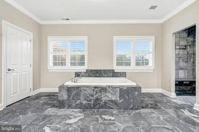 a bathroom with a sink toilet and a mirror