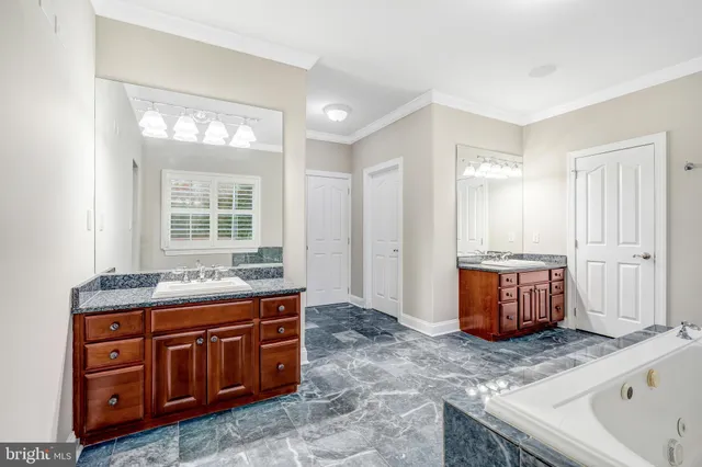 a view of an empty room with a window and a flat screen tv