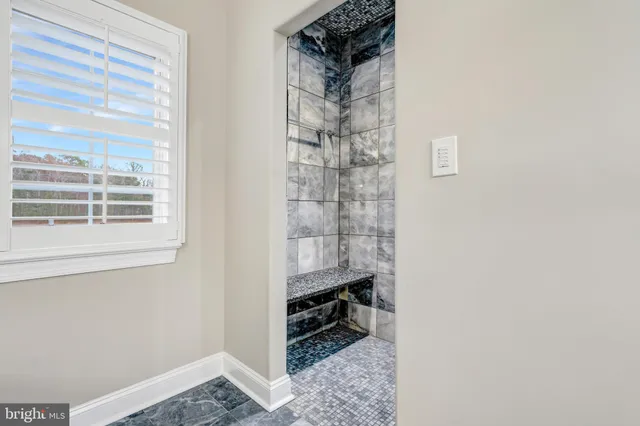 a view of bathroom with a toilet and a sink
