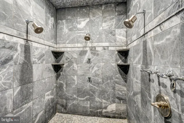 a bathroom with a toilet and a bathtub