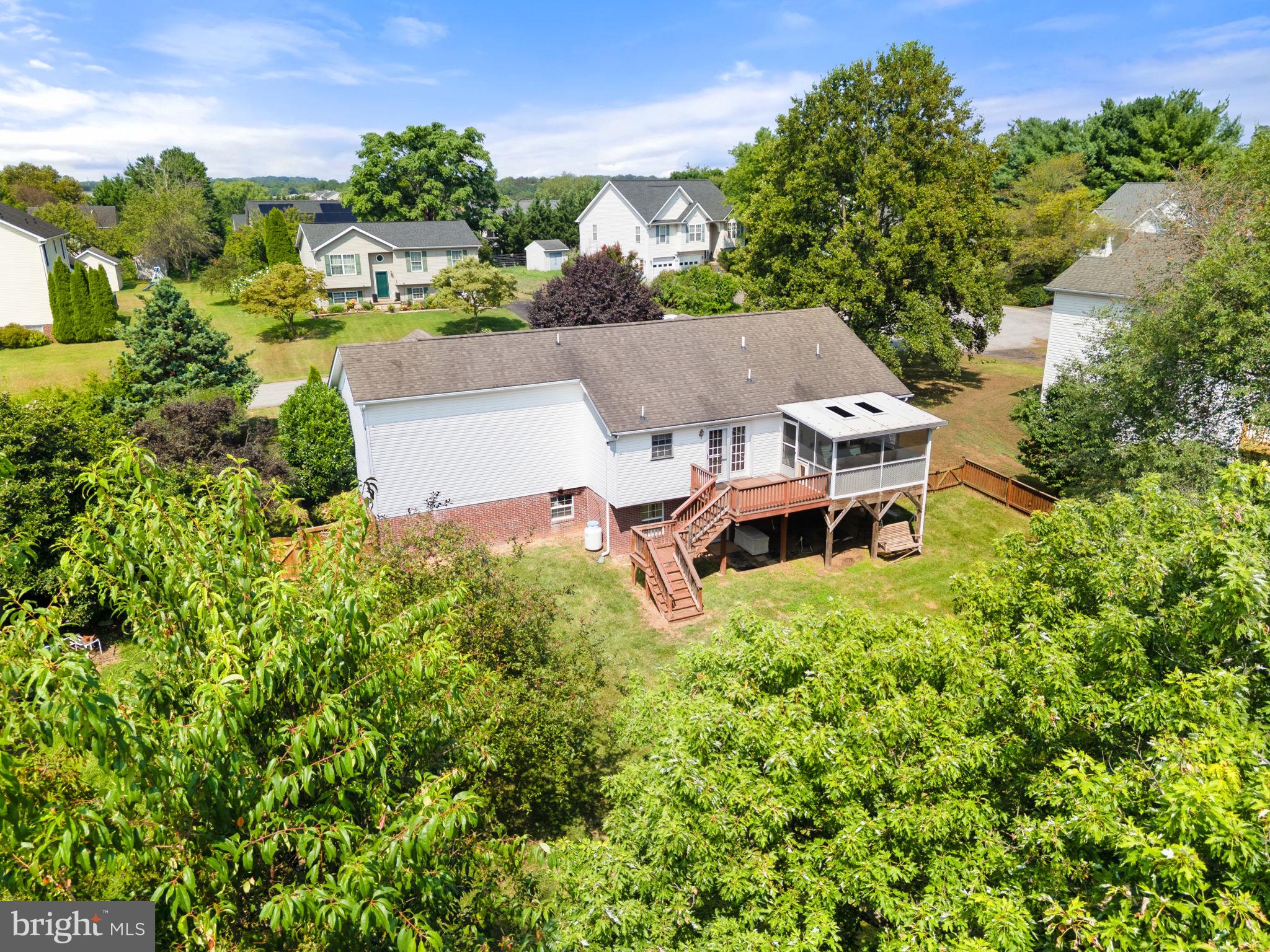 28 Mopsy Court Ranson, WV 25438 - Photo 54 of 59 an aerial view of a house with yard and outdoor seating