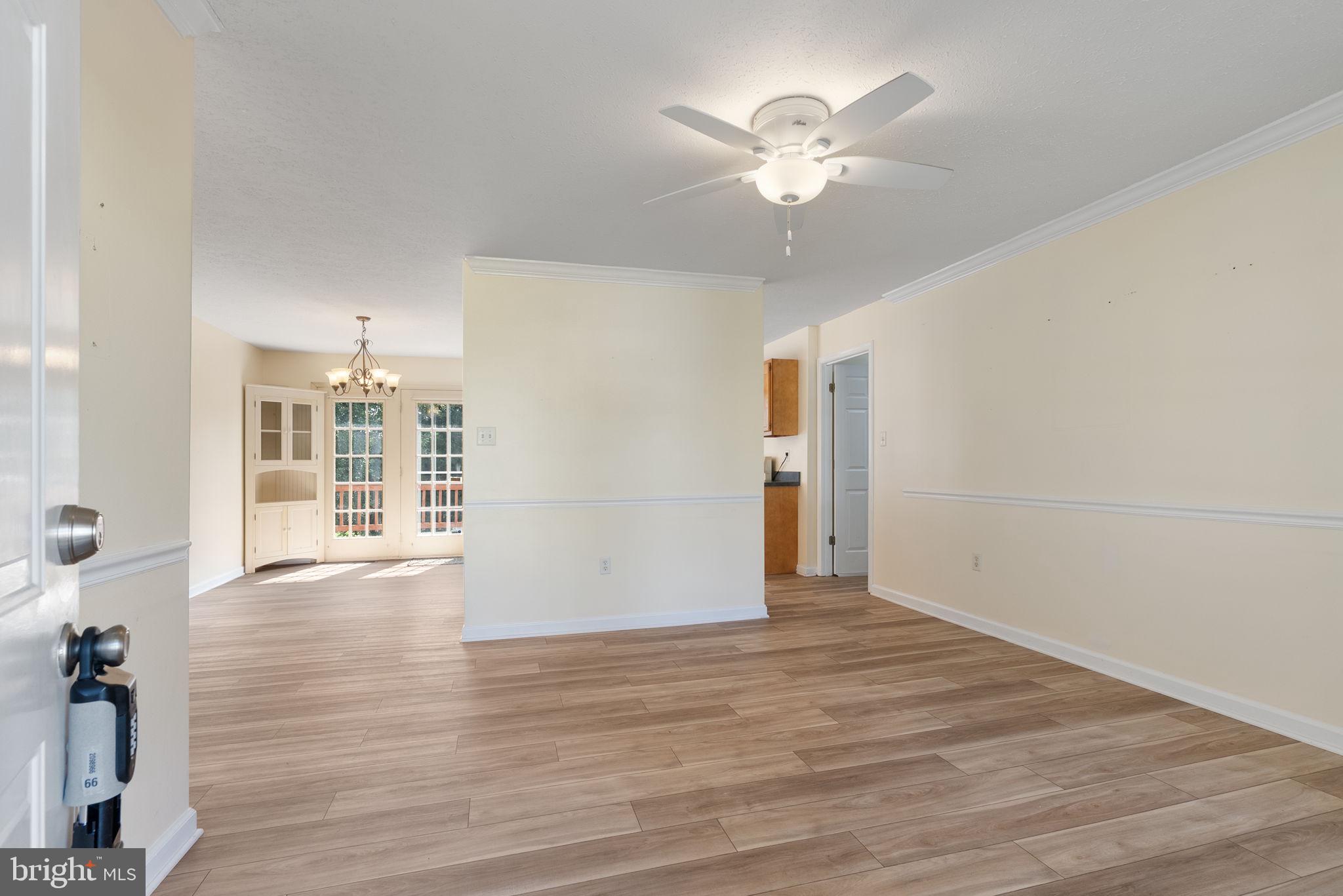 28 Mopsy Court Ranson, WV 25438 - Photo 8 of 59 wooden floor in an empty room with a window