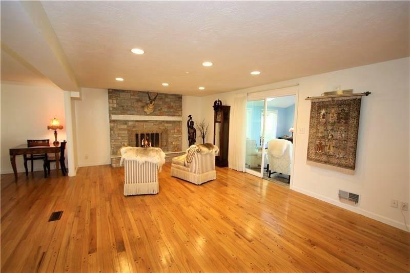 560 Justabout Road Peters Township, PA 15367 - Photo 14 of 25 Beautiful Refinished Hardwood Floors in Large 20x14 Living Room w/ Recessed Lighting, Stone Gas Fireplace, Plaster Walls & Sliding Glass Door to 13x12 Sun Room