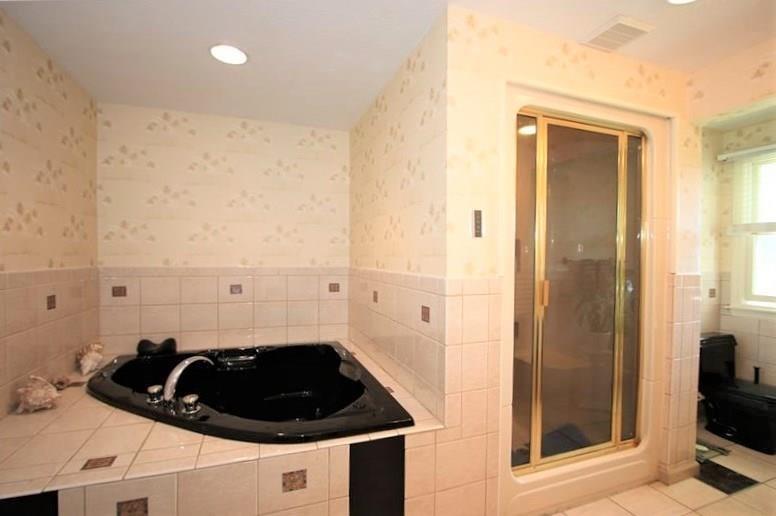 560 Justabout Road Peters Township, PA 15367 - Photo 19 of 25 Ceramic Tile surrounds Jet Tub & Separate Shower Stall in Master Bath w/ Ceramic Tile Floors too!