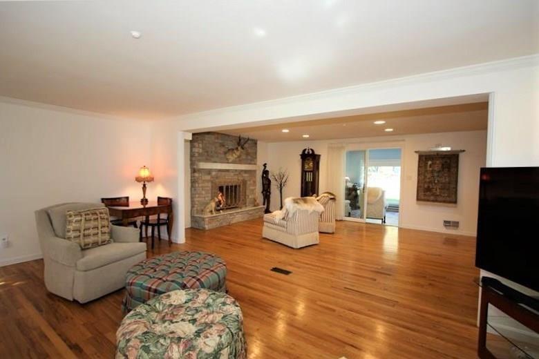 560 Justabout Road Peters Township, PA 15367 - Photo 7 of 25 GORGEOUS Refinished Original Hardwood Floors in 20x14 Family Room which opens into 20x14 Living Room w/ Gorgeous Stone Gas Log Fireplace and then leading into 13x12 Sunroom