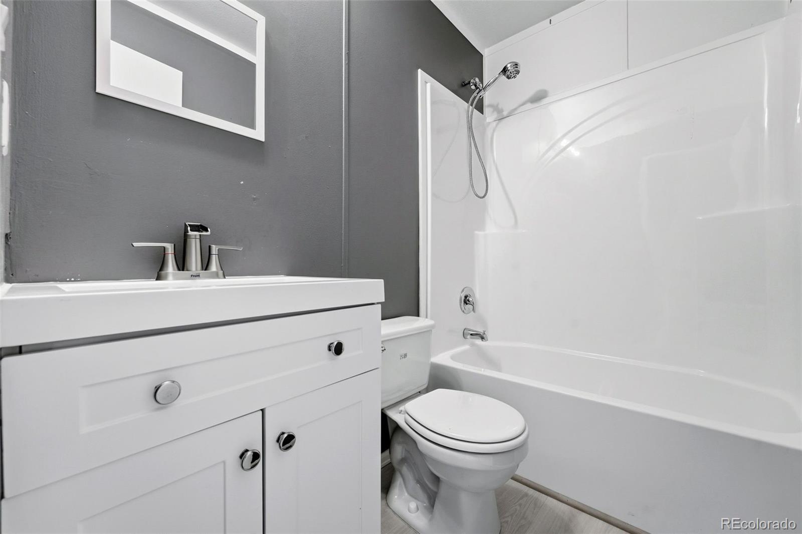 12205 Perry Street, Unit 271 Broomfield, CO 80020 - Photo 14 of 34 a bathroom with a sink a toilet and shower