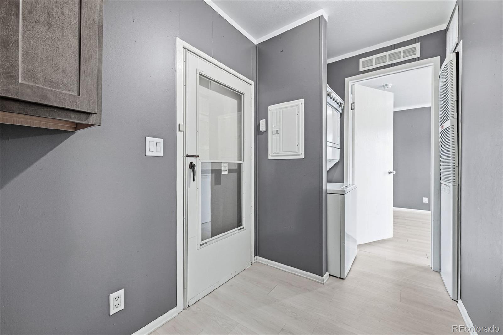 12205 Perry Street, Unit 271 Broomfield, CO 80020 - Photo 16 of 34 a view of a hallway with wooden cabinets