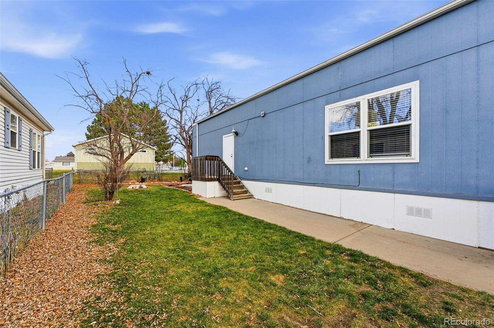 12205 Perry Street, Unit 271 Broomfield, CO 80020 - Photo 24 of 34 a house view with a backyard space