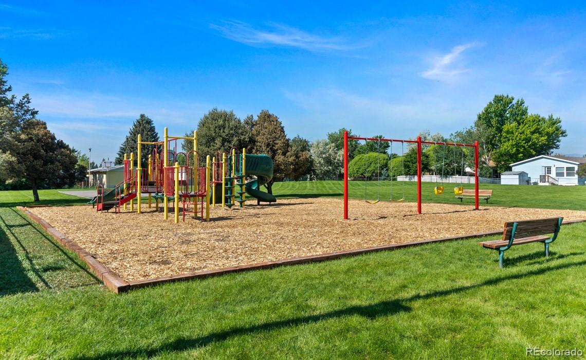 12205 Perry Street, Unit 271 Broomfield, CO 80020 - Photo 28 of 34 a view of a park with swings and slides