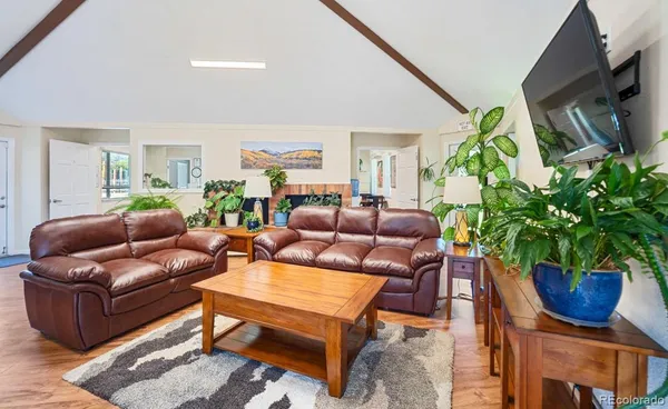 a room with pool table and windows
