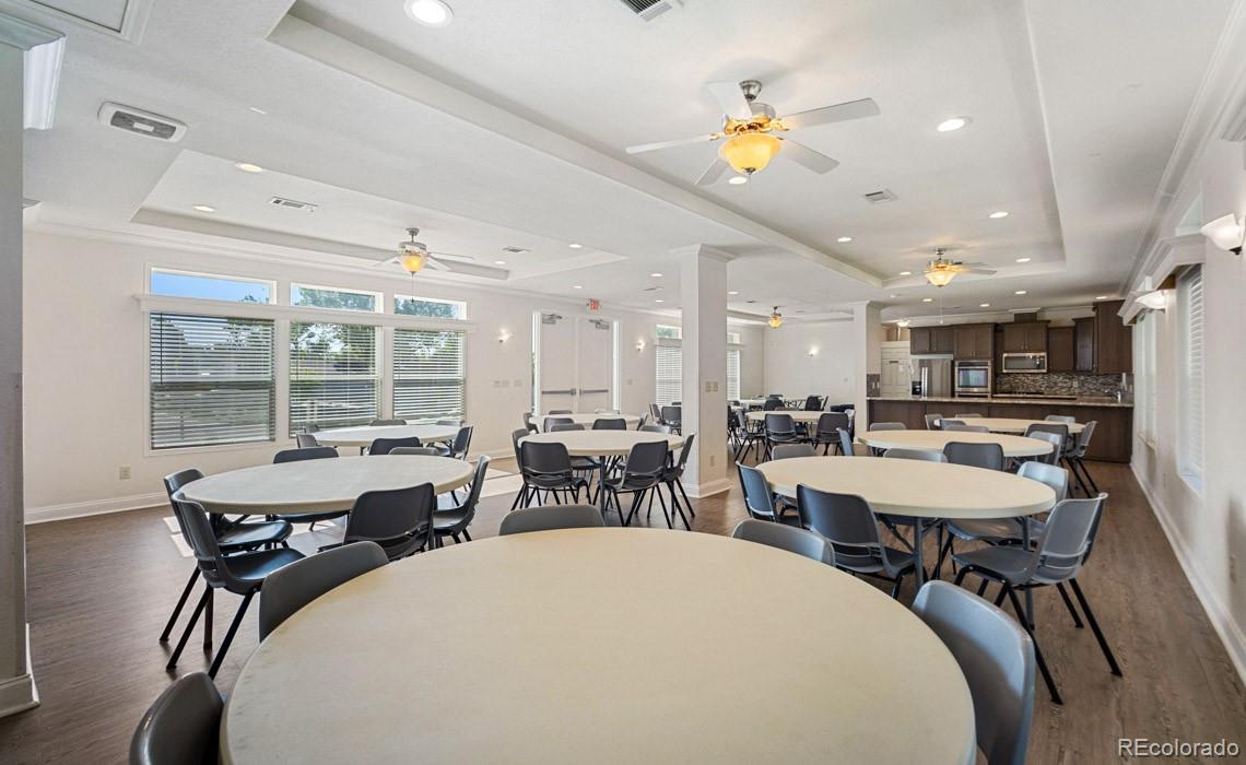 12205 Perry Street, Unit 271 Broomfield, CO 80020 - Photo 33 of 34 a view of a dining room with furniture and a large window