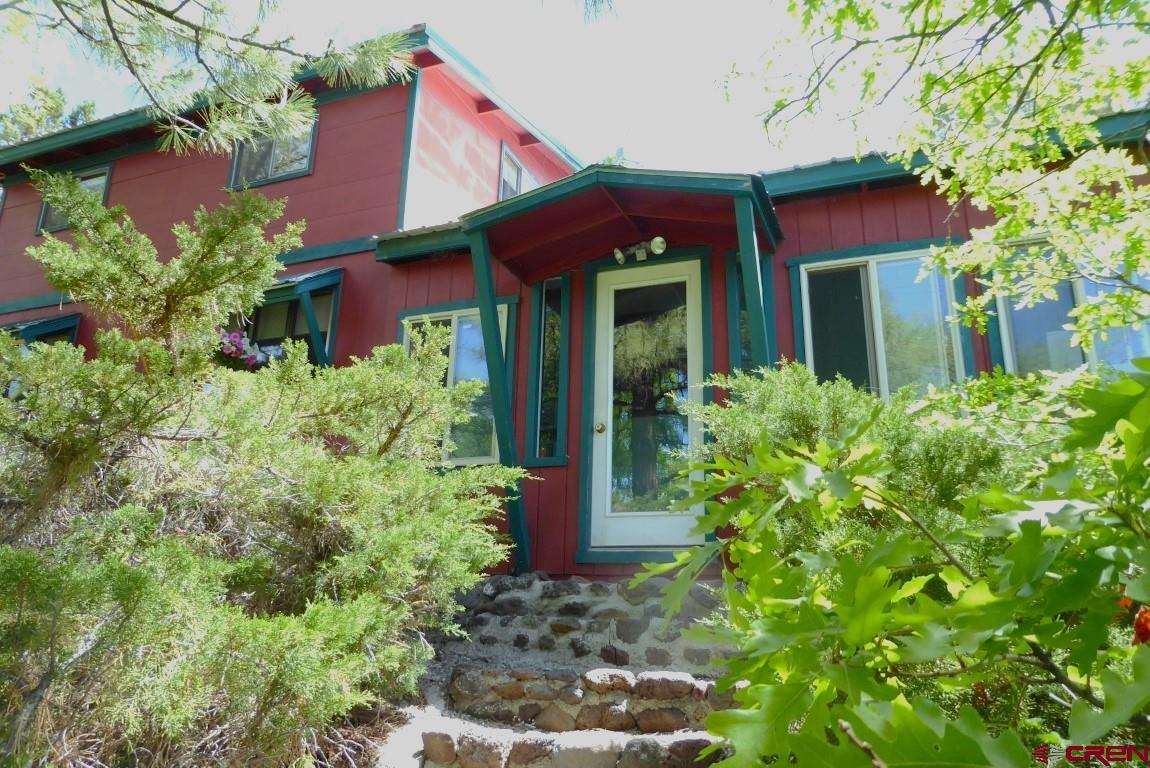 21550 2300th Road Cedaredge, CO 81413 - Photo 2 of 35 a view of a house with potted plants