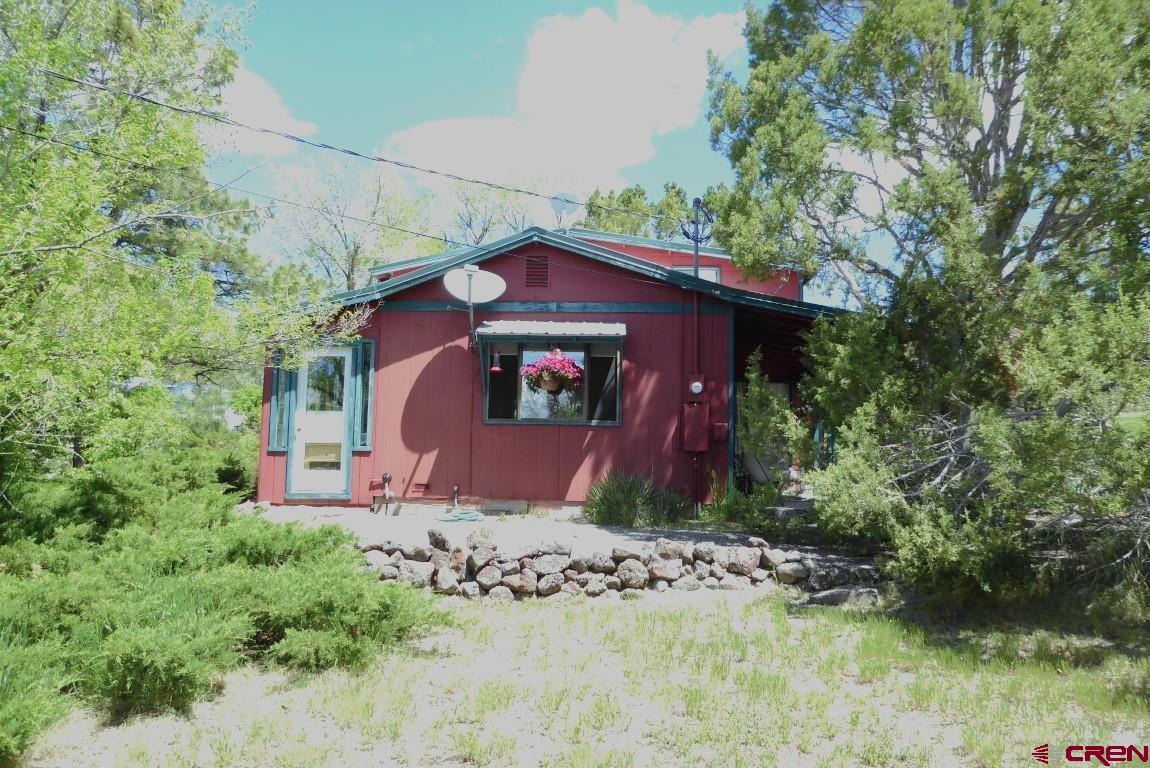 21550 2300th Road Cedaredge, CO 81413 - Photo 22 of 35 a view of a house with a yard