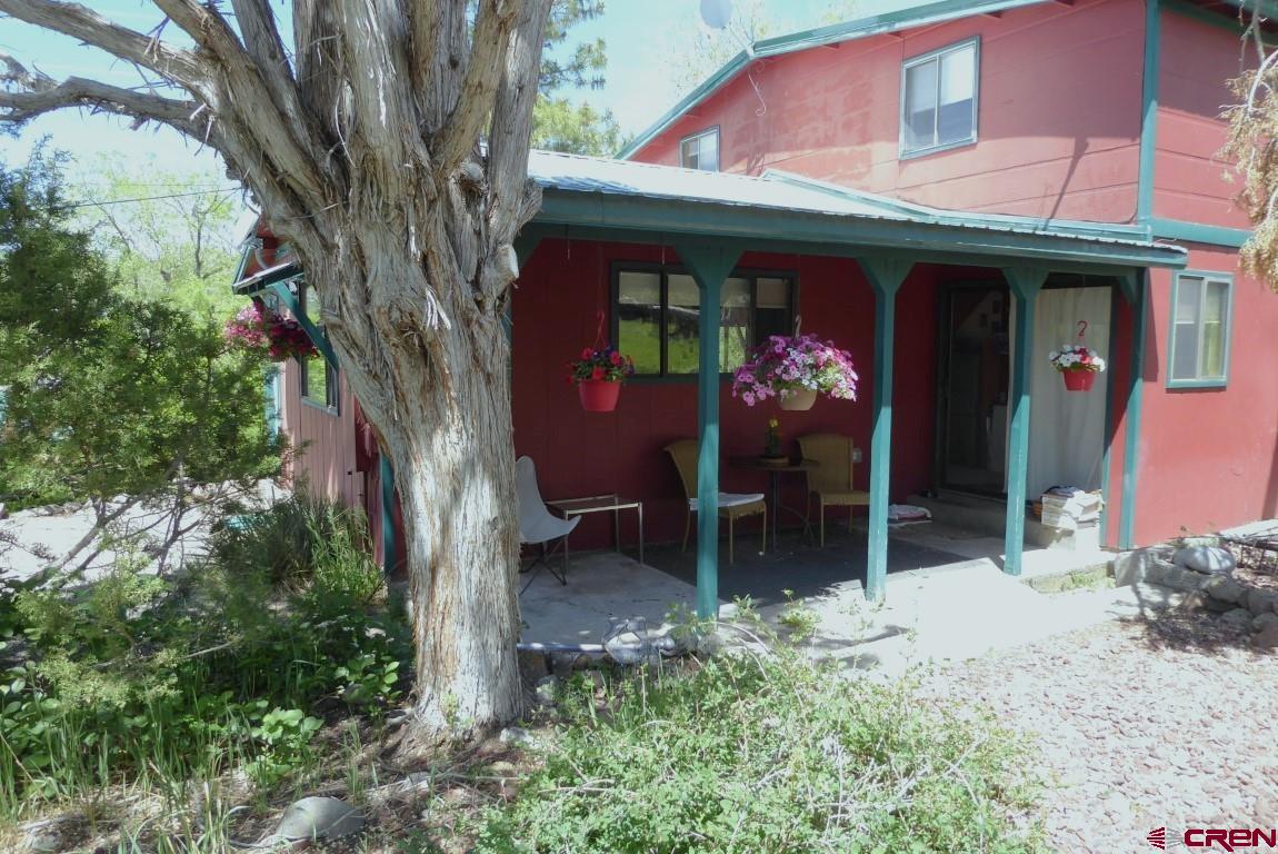 21550 2300th Road Cedaredge, CO 81413 - Photo 23 of 35 a view of a chairs and table in a backyard