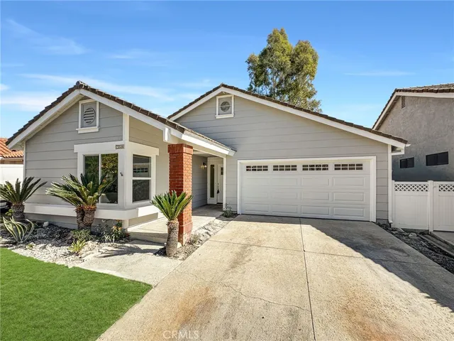 a front view of a house with yard and seating space