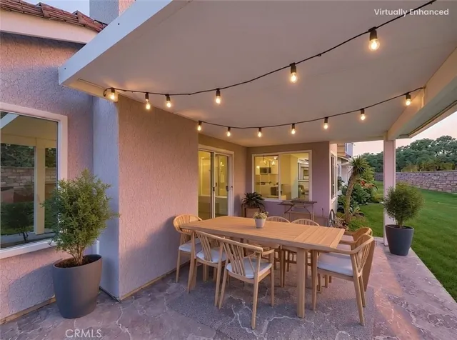 a view of a dining room with furniture and garden
