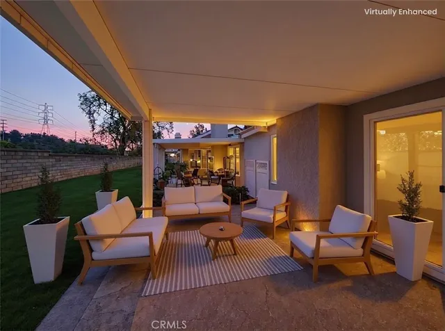 a outdoor space with patio couches and a potted plant