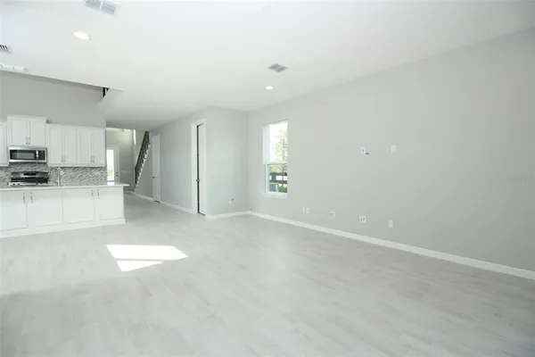 a view of a hallway with windows