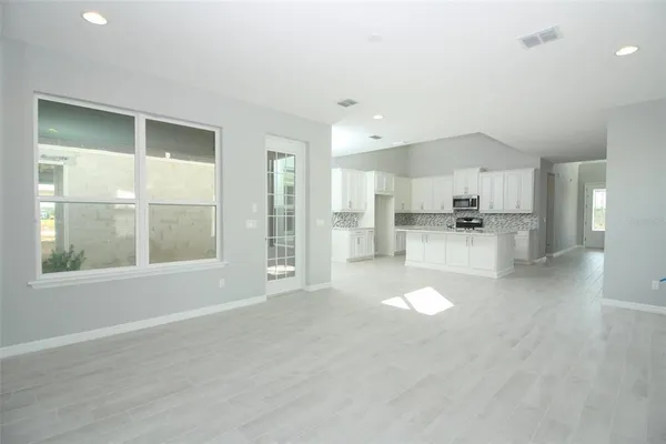 a view of a hallway with windows