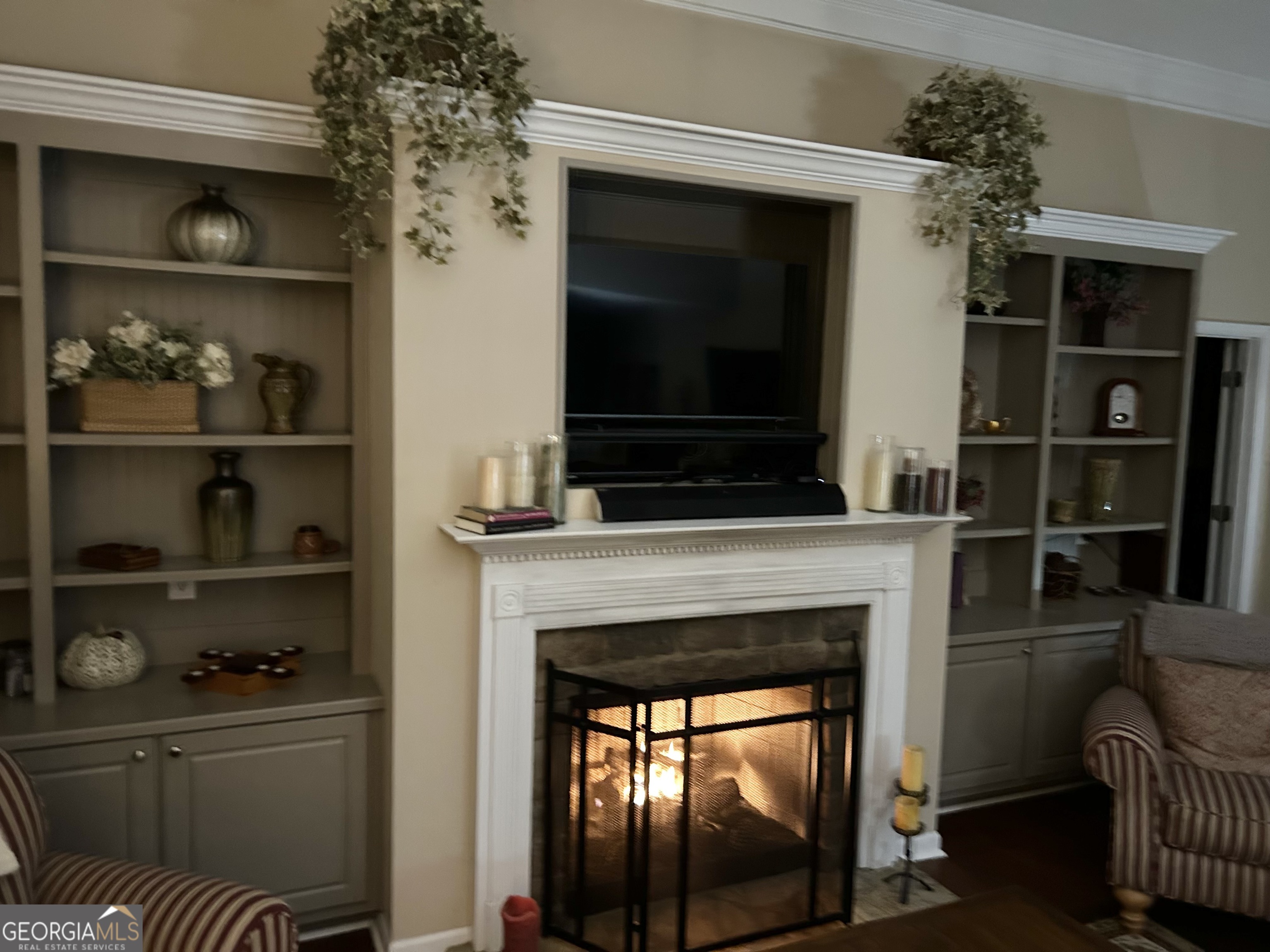 950 John Lovelace Road LaGrange, GA 30241 - Photo 12 of 47 a living room with a fireplace and a flat screen tv