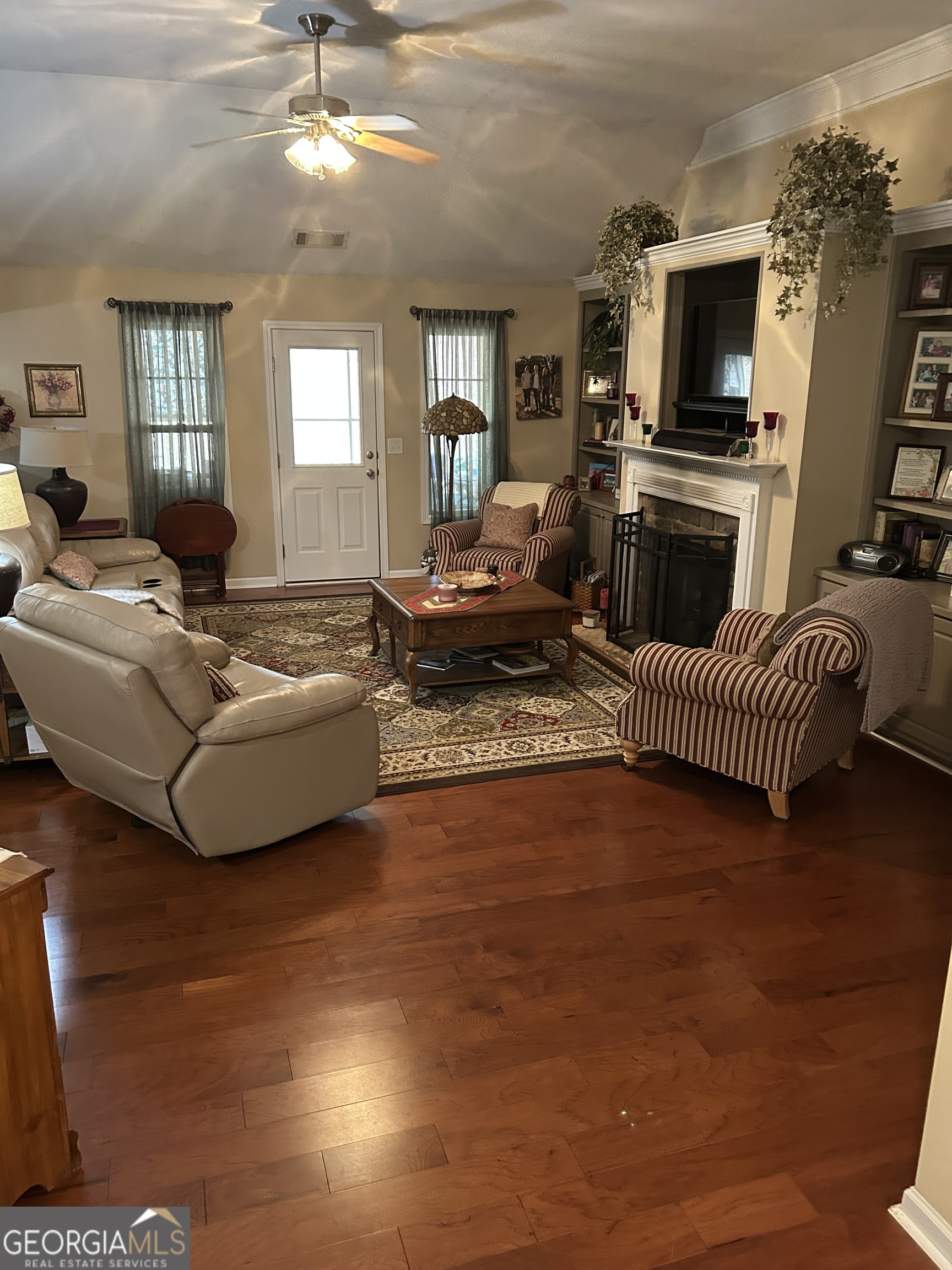 950 John Lovelace Road LaGrange, GA 30241 - Photo 15 of 47 a living room with fireplace furniture and a flat screen tv