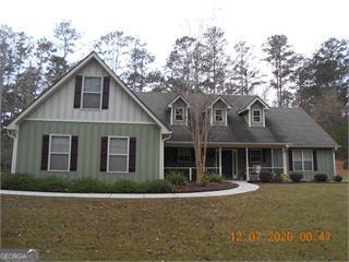 950 John Lovelace Road LaGrange, GA 30241 - Photo 2 of 47 a front view of a house with garden
